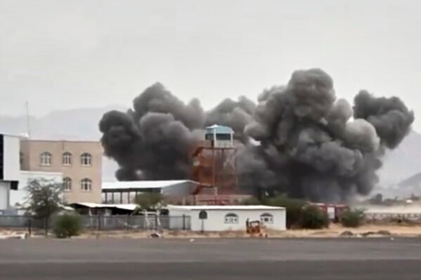 This image taken from video broadcast by Al-Masirah TV, a Houthi-controlled news channel, shows an explosion at the Sanaa International Airport compound during what the Iranian-backed Houthi rebels in Yemen said were several Saudi airstrikes in Sanaa, Yemen, July 13, 2026. (Al-Masirah TV via AP, File)