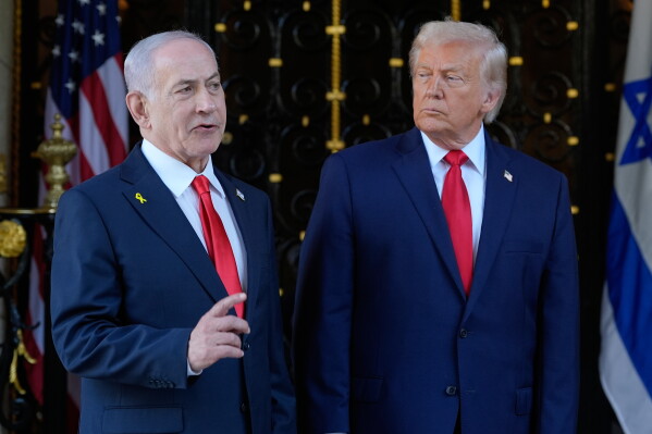 President Donald Trump listens as Israel's Prime Minister Benjamin Netanyahu speaks at President Donald Trump's Mar-a-Lago club, Dec. 29, 2025, in Palm Beach, Fla. (AP Photo/Alex Brandon, File)