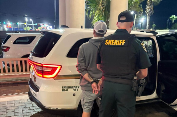 This photo provided by the Okaloosa County Sheriff's Office shows Christopher Gillum being arrested Wednesday, April 22, 2026, at a hotel in Destin, Fla. (Okaloosa County Sheriff's Office via AP,File)