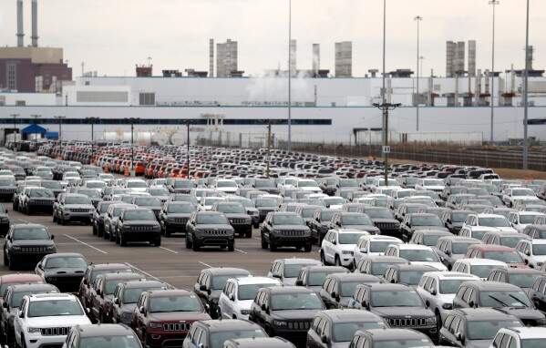 In this Feb. 26, 2019, file photo, Jeep vehicles are parked outside the Jefferson North Assembly Plant in Detroit. (AP Photo/Carlos Osorio, File)
