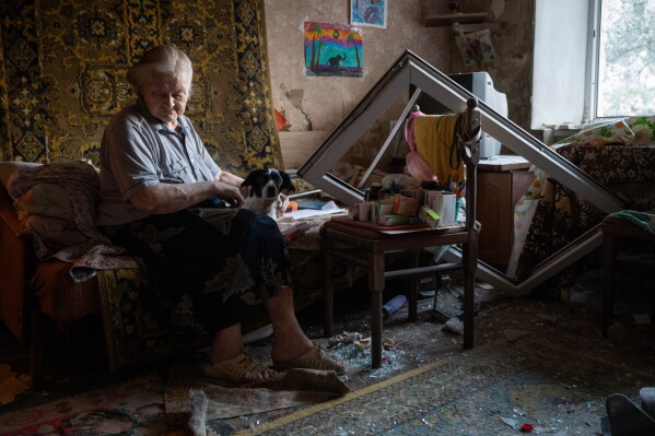 Elderly Liudmyla Tsapkova sits in her damaged apartment after a Russian missile attack in Kyiv, Ukraine, Thursday, July 2, 2026. (AP Photo/Danylo Antoniuk, File)