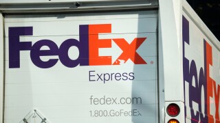 FILE - The company logo is shown on a FedEx delivery van, Sept. 13, 2023, in downtown Denver.