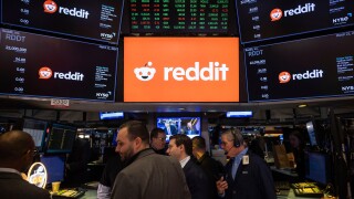 FILE - Reddit Inc. logos are displayed on the New York Stock Exchange trading floor, prior to the company's IPO, Thursday, March. 21, 2024.