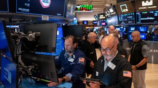 Trader Fred Demarco, right, and Specialist Michael Pistillo, left, work on the floor of the New York Stock Exchange, Friday, Aug. 7, 2026, in New York.