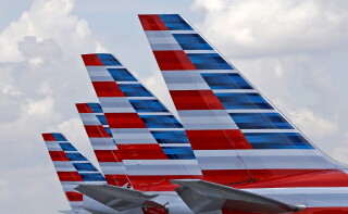 American Airlines passenger planes are parked at Miami International Airport, in Miami on July 17, 2015. (AP Photo/Alan Diaz, File)