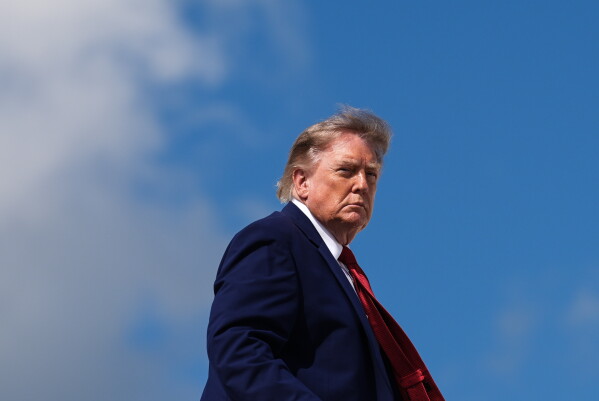 President Donald Trump boards Air Force One, Aug. 7, 2026, at Joint Base Andrews, Md. (AP Photo/Julia Demaree Nikhinson, File)