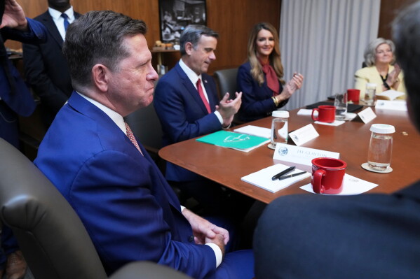 Jay Clayton, left, listens during a cabinet meeting, Friday, July 31, 2026, at Camp David, the presidential retreat, near Thurmont, Md., Friday, July 31, 2026. (AP Photo/Jacquelyn Martin)