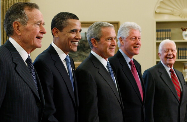 President George W. Bush, center, poses with President-elect Barack Obama, and former presidents, from left, George H.W. Bush, left, Bill Clinton and Jimmy Carter, right, Jan. 7, 2009, in the Oval Office of the White House in Washington. (AP Photo/J. Scott Applewhite, File)