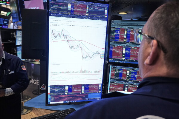 Specialist Anthony Matesic works at his post on the floor of the New York Stock Exchange, Wednesday, June 3, 2026. (AP Photo/Richard Drew)