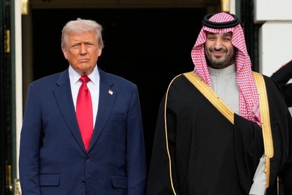 President Donald Trump stands with Saudi Arabia's Crown Prince Mohammed bin Salman on his visit to the White House, Nov. 18, 2025, in Washington. (AP Photo/Mark Schiefelbein, File)