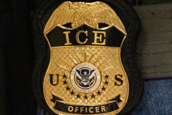 A federal agent wears an Immigration and Customs Enforcement badge in New York, June 10, 2025. (AP Photo/Yuki Iwamura, File)