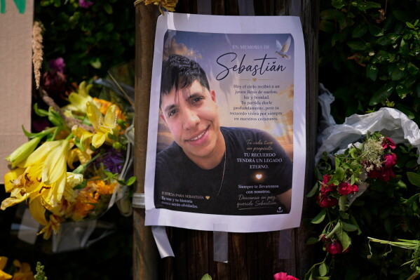 A poster of Johan Sebastián Durán Guerrero, a man killed by U.S. Immigration and Customs Enforcement, is displayed among flowers and tributes at a makeshift memorial in Biddeford, Maine, July 15, 2026. (AP Photo/Robert F. Bukaty, File)