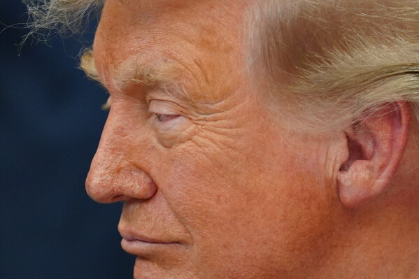 President Donald Trump speaks in the Oval Office of the White House about Dulles International Airport modernization, Wednesday, July 29, 2026, in Washington. (AP Photo/Julia Demaree Nikhinson)