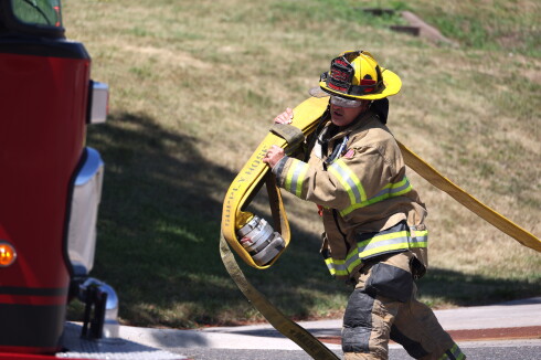 Firefighter runs hose line