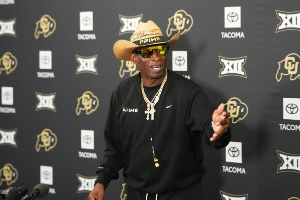 Colorado head coach Deion Sanders talks to reporters after practice at an NCAA college football training camp in Fountain, Colo., Thursday, Aug. 6, 2026. (AP Photo/David Zalubowski)