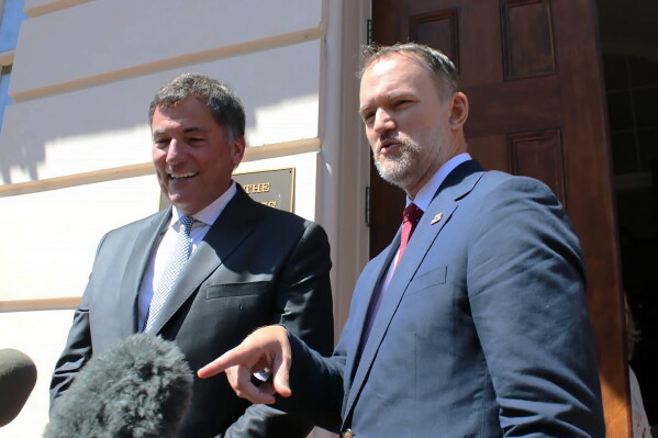 Canada-U.S. Trade Minister Dominic LeBlanc, left, and United States Trade Representative Jamieson Greer speak to reporters in Washington, D.C., on Wednesday, Aug. 19, 2026, the day after the Trump administration temporarily delayed tariffs on Canada. (Kelly Geraldine Malone/The Canadian Press via AP)