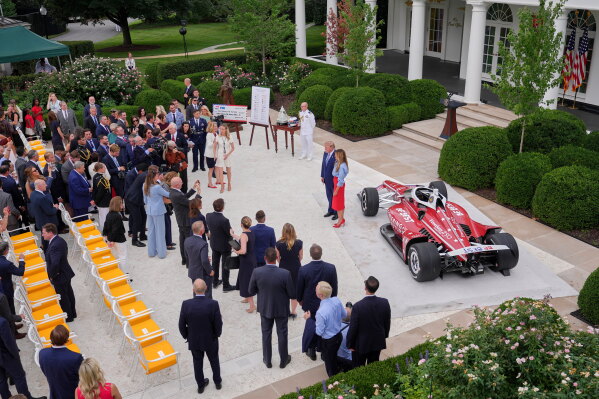 President Donald Trump, center left, and first lady Melania Trump pose for a photo as they attend an event in the Rose Garden of the White House, Thursday, Aug. 20, 2026, in Washington. (AP Photo/Jacquelyn Martin)