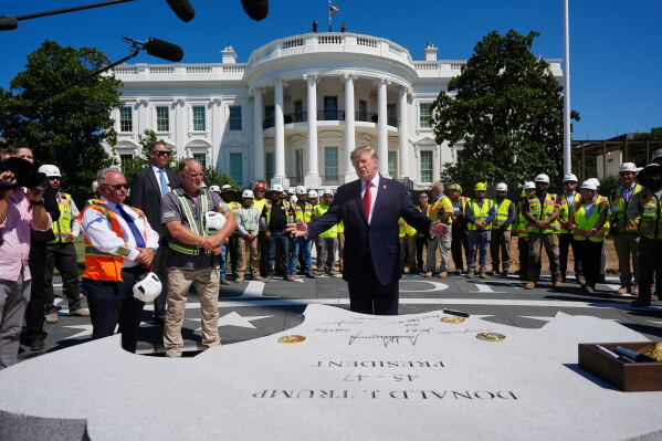 President Donald Trump speaks outside the White House, Wednesday, Aug. 19, 2026, in Washington, at the construction site of the new helicopter landing zone on the South Lawn of the White House. (AP Photo/Manuel Balce Ceneta)