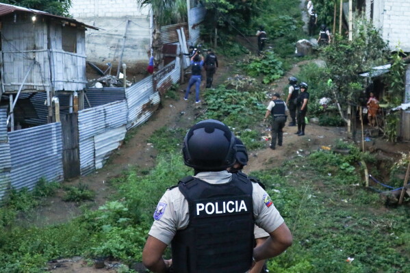 Police conduct an operation searching for weapons and or drugs as part of an effort to combat criminal groups, in the Nueva Guayaquil neighborhood of Guayaquil, Ecuador, April 4, 2024. (AP Photo/Cesar Munoz, File)
