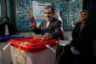 Former Revolutionary Guard commander Mohsen Rezaei casts his ballot during the parliamentary and Assembly of Experts elections at a polling station in Tehran, Iran, March 1, 2024. (AP Photo/Vahid Salemi, File)