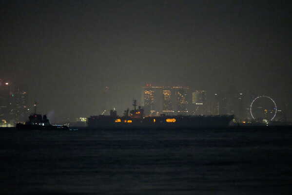 The U.S. Navy aircraft carrier USS Abraham Lincoln sails past Singapore as seen from Batam, Indonesia, Sunday, Aug. 30, 2026. (AP Photo/Dita Alangkara)