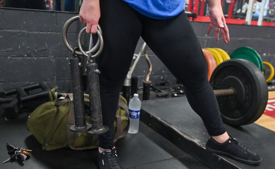 Teresa Troiani uses a special bar to practice lifting the Dinnie Stones at Rocky Boxing Club in Berwick.