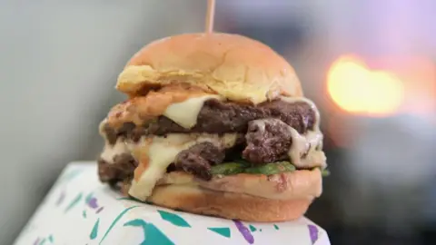 AFP via Getty Images A burger at a restaurant in New York City