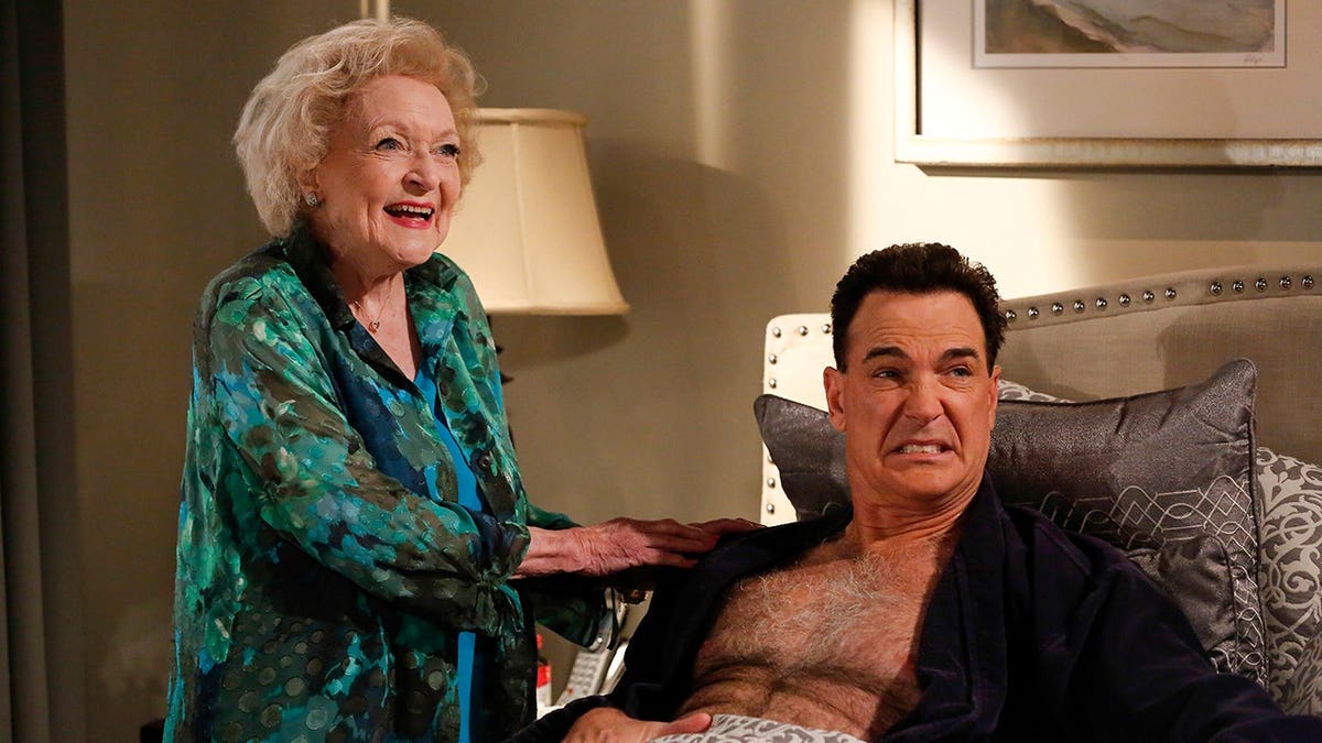Betty White and Patrick Warburton stand together in a scene from The Fixer.
