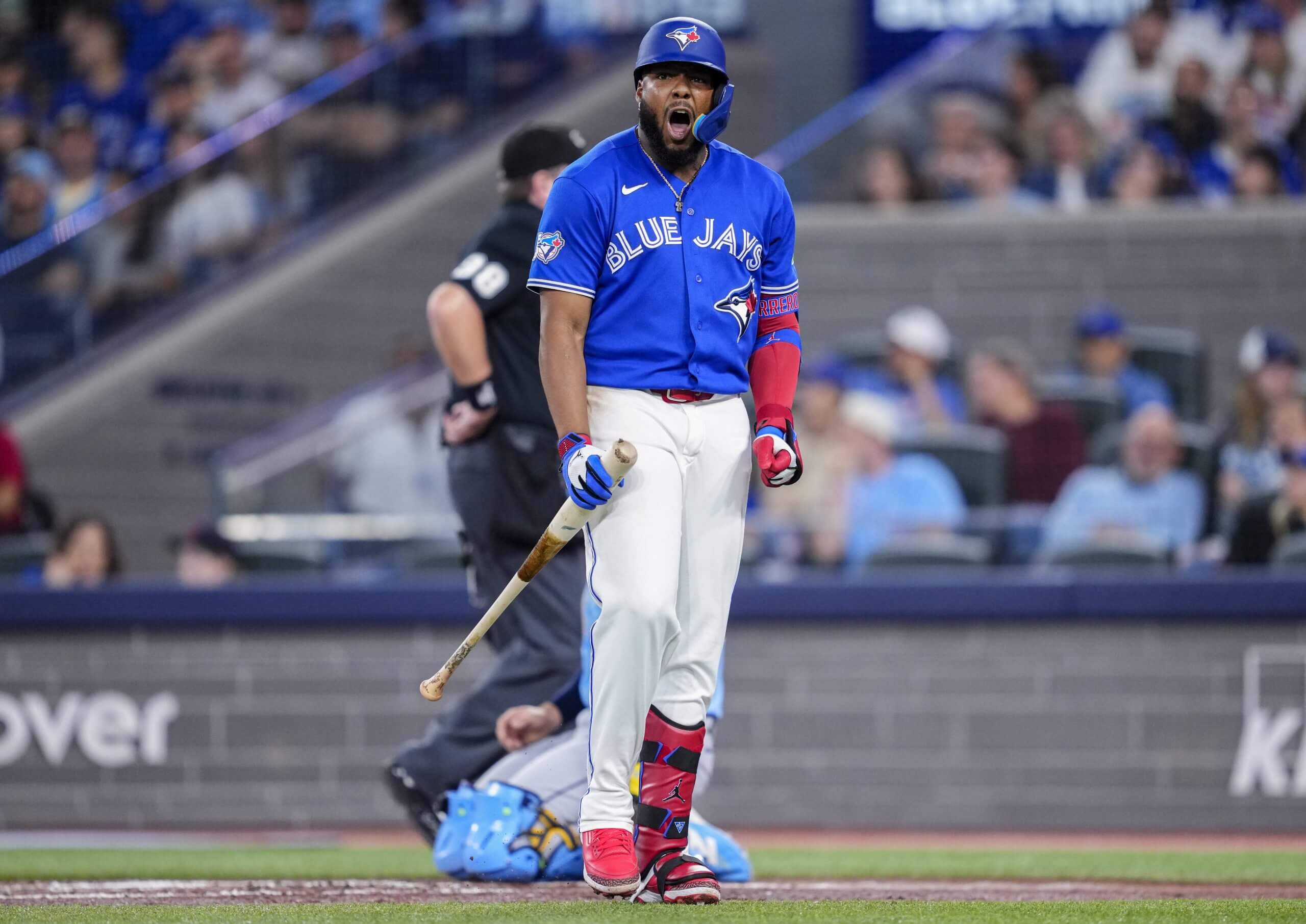 Vladimir Guerrero Jr. #27 of the Toronto Blue Jays reacts to striking out against the Tampa Bay Rays during the first inning in their MLB game at the Rogers Centre on July 21, 2026 in Toronto, Ontario, Canada.