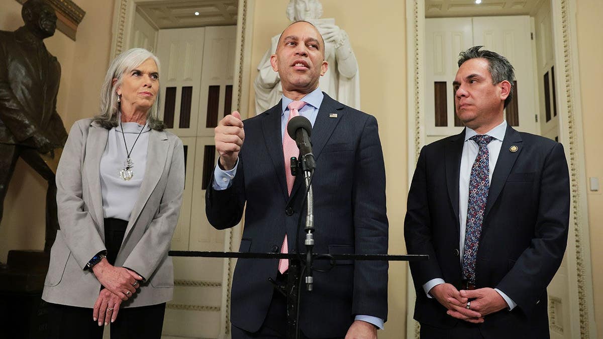 Hakeem Jeffries speaks alongside Pete Aguilar and Katherine Clark at a news conference in Washington, D.C.