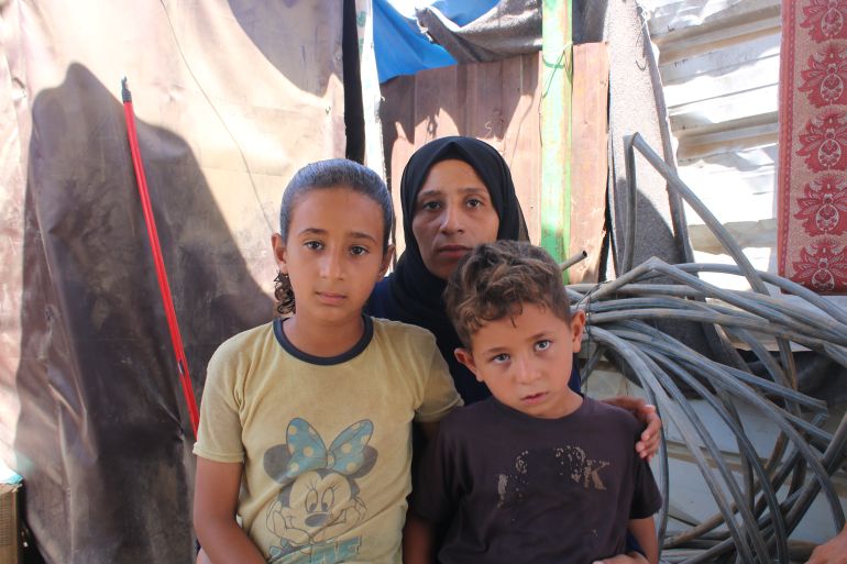Huda Zaqout with her children Maysara and Jawad in Maghazi, Gaza
