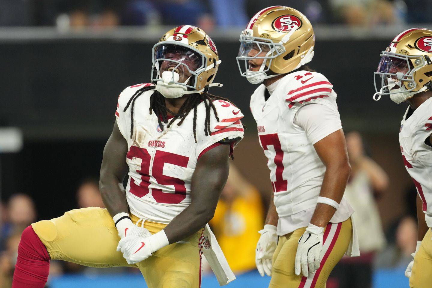 Sincere McCormick (35) celebrates after scoring a touchdown for San Francisco.