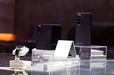 Samsung's newest Galaxy Z foldables are seen in Dubai. The company told The National that it is working with telecom firms and retailers to offer more affordable buying options for consumers. Chris Whiteoak / The National