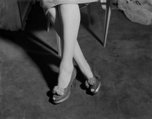 Cropped view of pair of female legs wearing spotted high-heel shoes with sparkling bows, circa 1950. (Photo by Central Press/Hulton Archive//Getty Images)