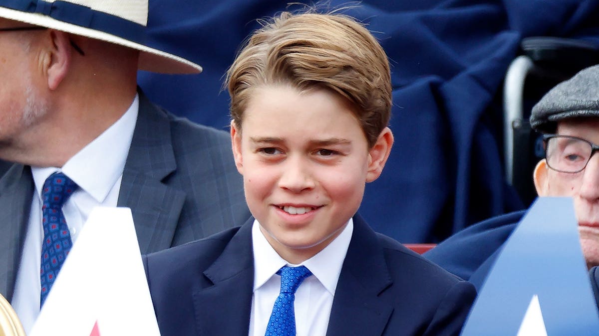 Prince George of Wales attends a military procession on The Mall in London.