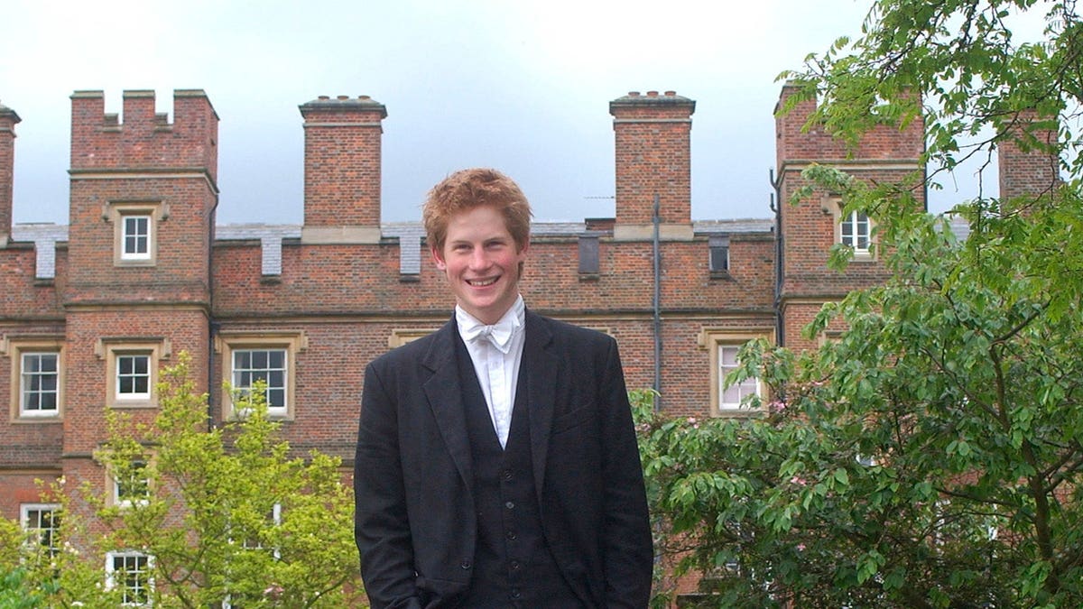 Prince Harry stands in school dress at Eton College.
