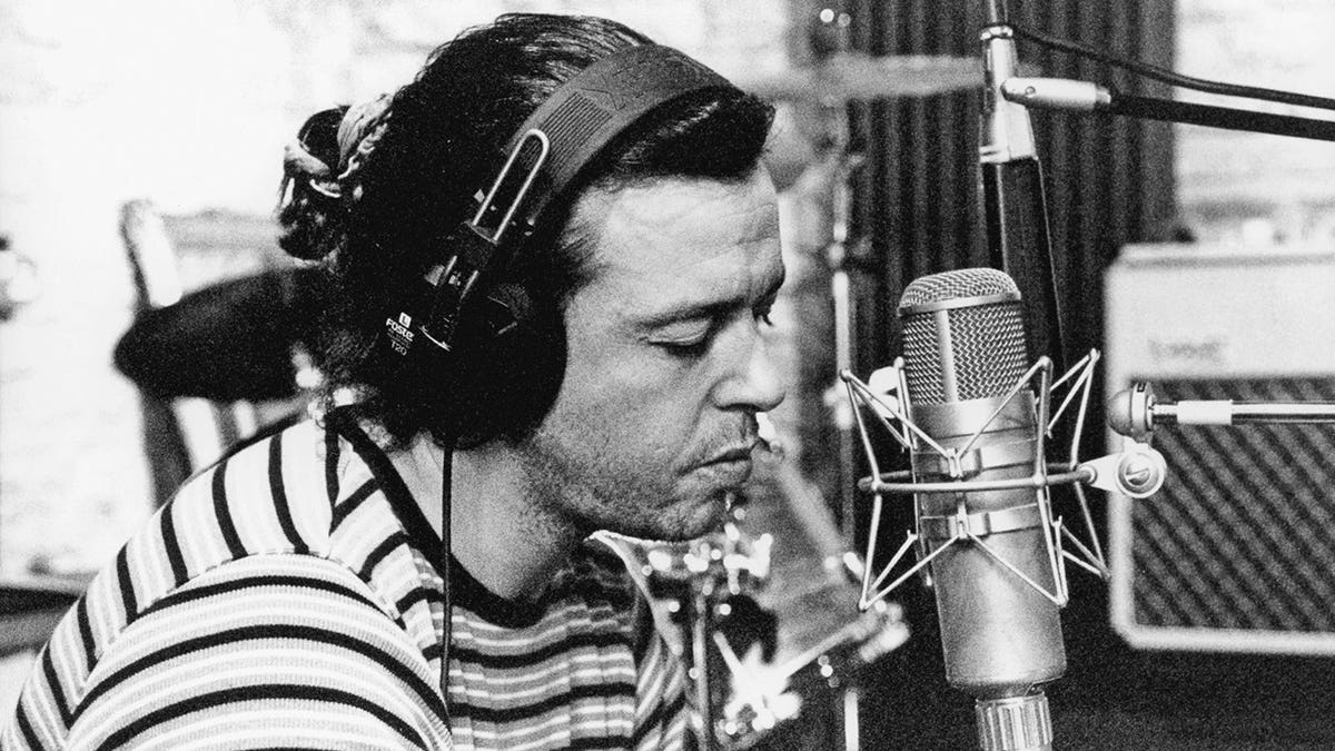 Roland Orzabal recording music at a studio.