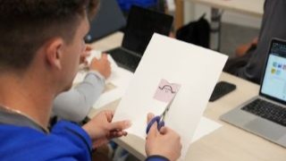 Student-athlete prepares his keychain design.