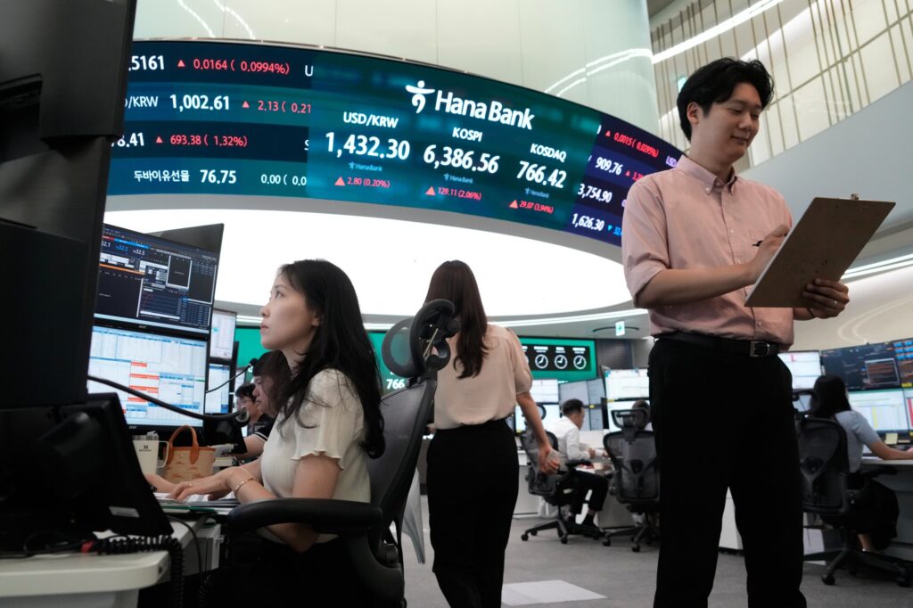 Oil prices gain and global shares are mostly higher after a rally on Wall Street