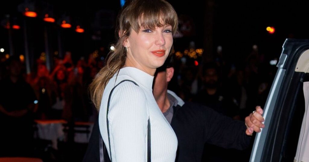 Taylor Swift Adds Bling to Micro Minidress With Christian Louboutin Bag Taylor Swift Adds Bling to Micro Minidress With Christian Louboutin Bag