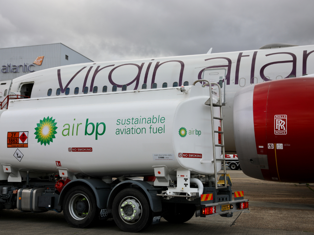 A BP fuelling truck next to a Virgin Atlantic aircraft