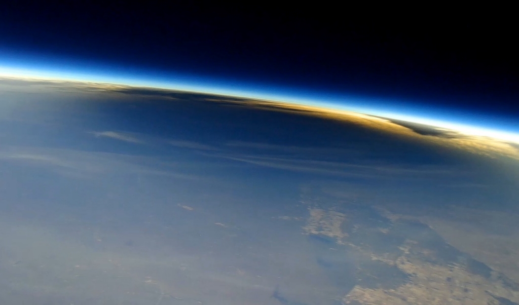 The Moon’s shadow on Earth during the total solar eclipse on April 8, 2024, as seen from about 90,000 feet from a camera carried by a scientific balloon.
