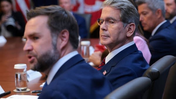 Treasury Secretary Scott Bessent sitting next to Vice President JD Vance at a Cabinet meeting at Camp David in July. On Tuesday, August 4, Bessent said that America's K-shaped economy had ended.