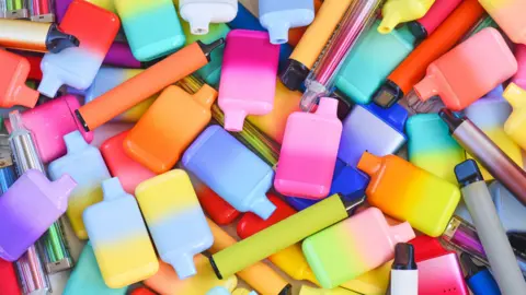 Getty Images A photo of many bright, multicoloured vapes in different shapes and sizes.