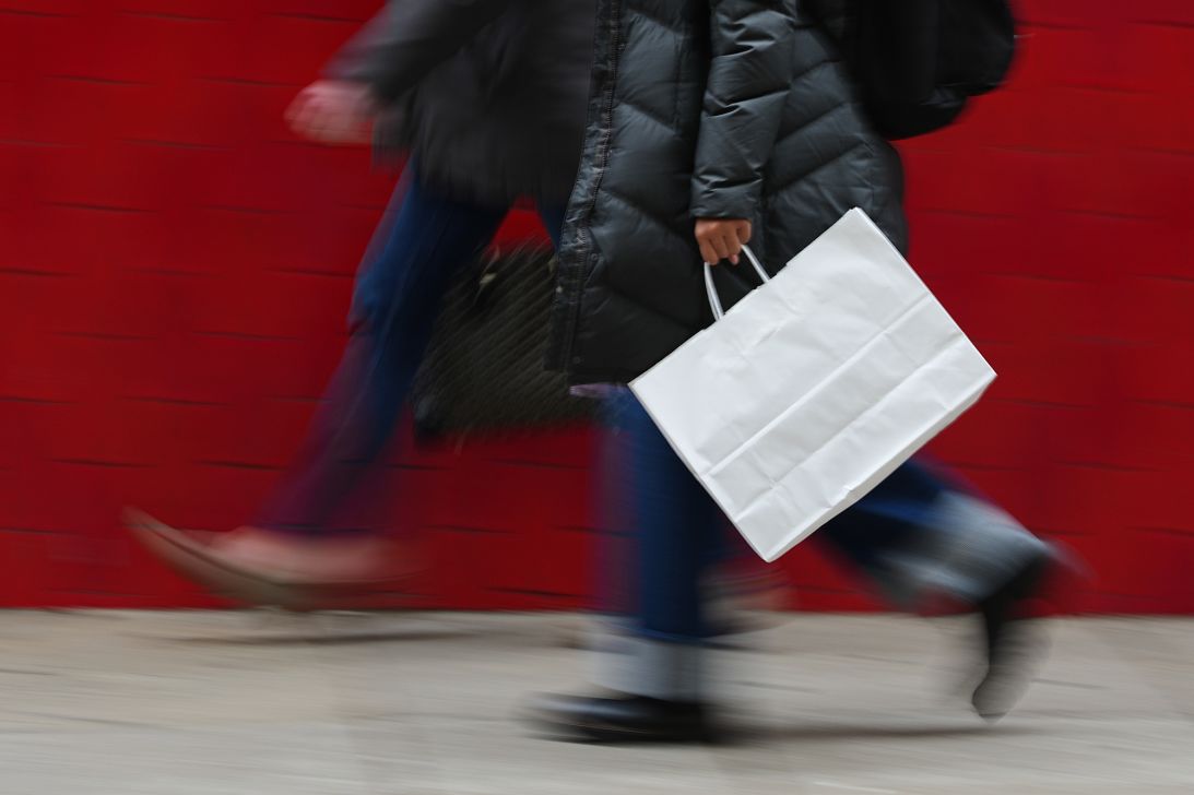 A person carries a shopping bag in Philadelphia, on December 10, 2025.