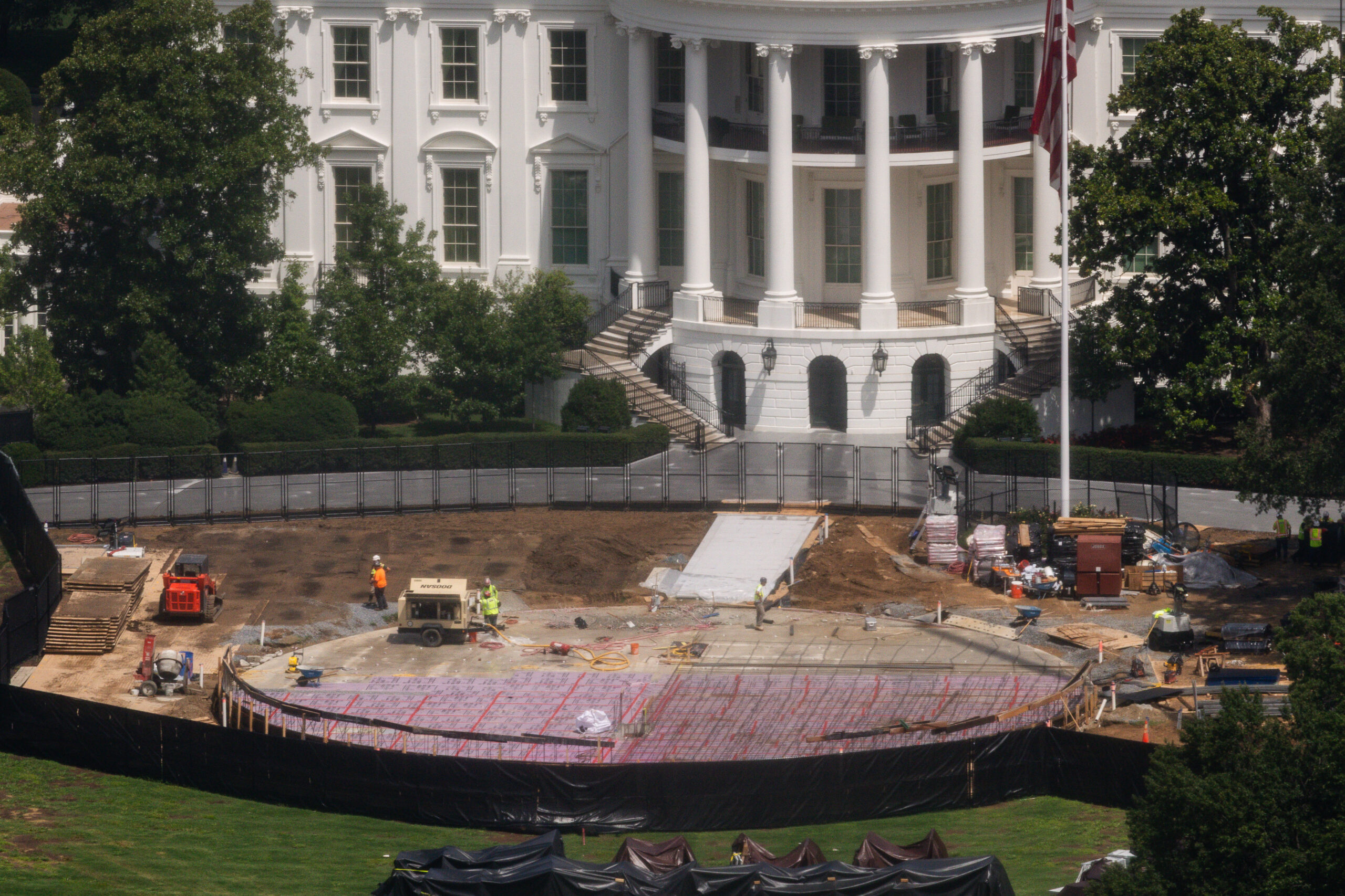 Construction continues on a helipad on the South Lawn of the White House, Wednesday, Aug. 5, 2026, in Washington.