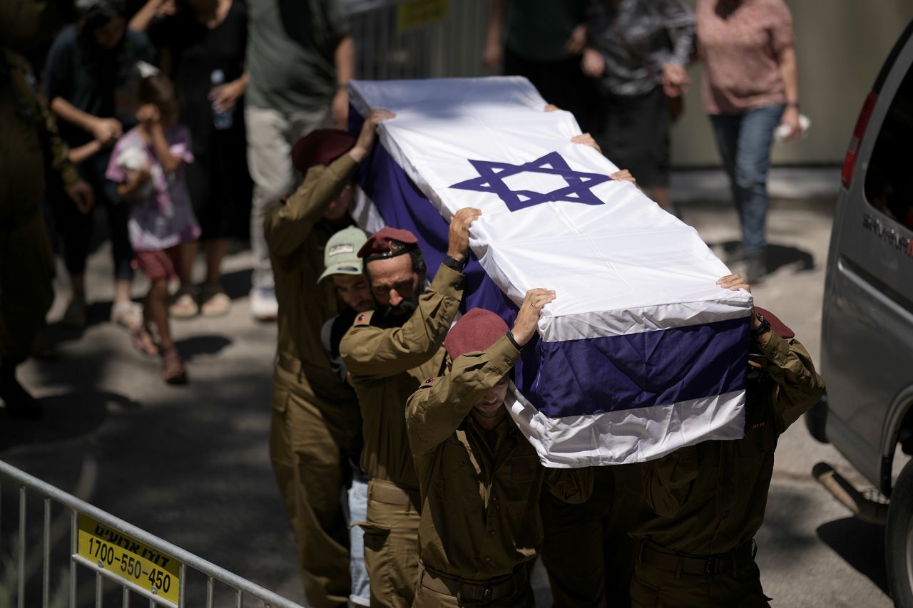 Members of Israeli defense forces carry the coffin of reservist Major Harel Birenstock, who was killed in an explosion in southern Lebanon, during his funeral at Mount Herzl Military Cemetery in Jerusalem, on Thursday.