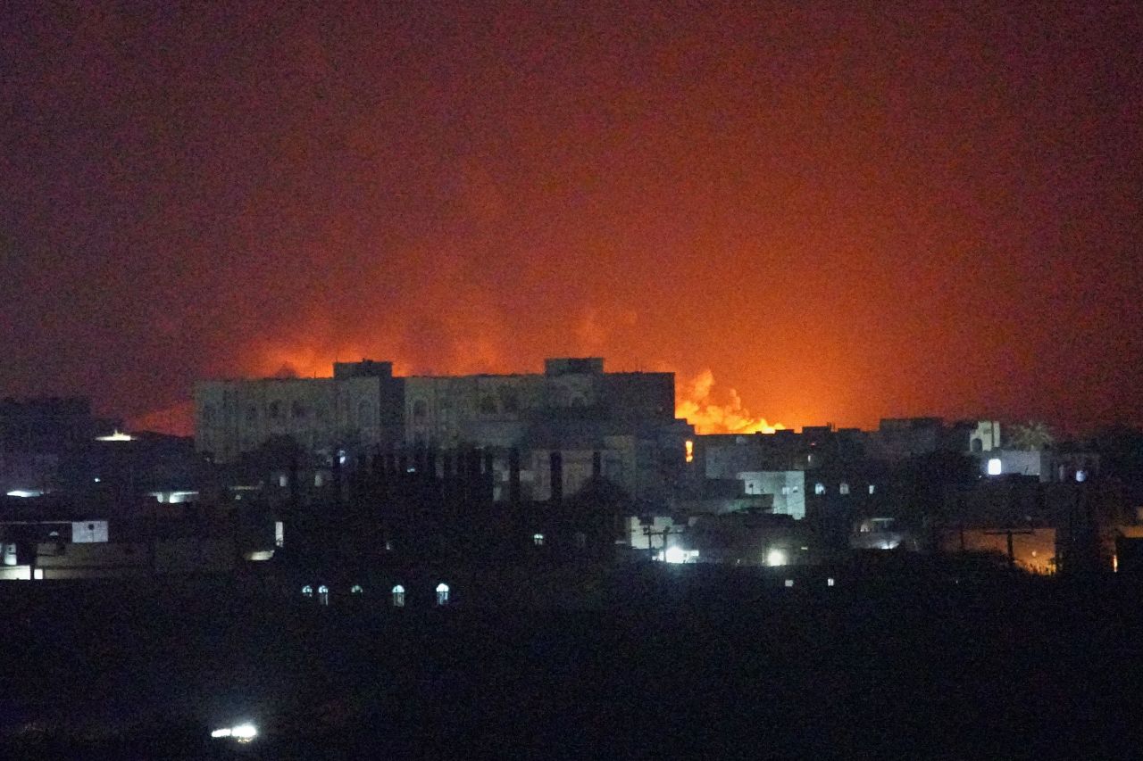 Flames and smoke rise from the port of Mokha during a strike in Yemen on August 14.