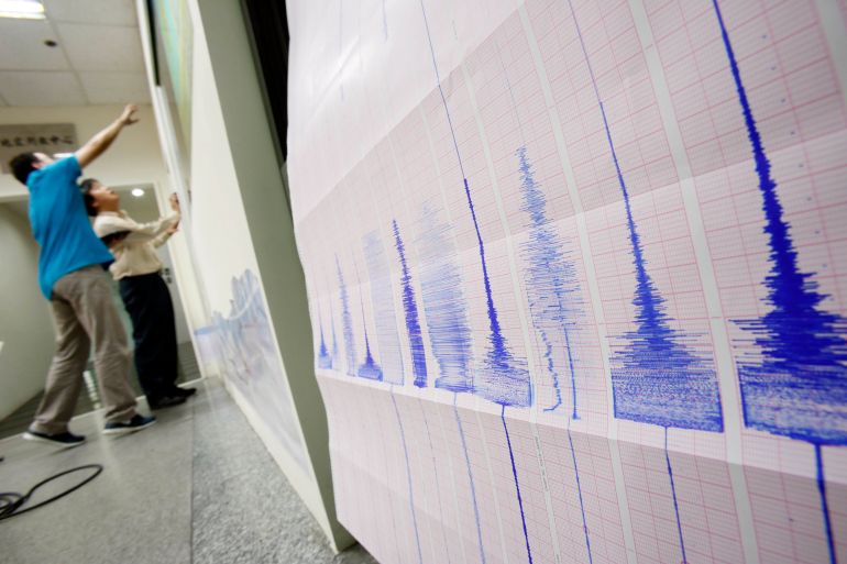 Seismogram recordings of a strong earthquake that shook the island print out as seismologists chart the epicenter map at the Seismology Center in Taipei, Taiwan, late Thursday, Oct. 31, 2013. The U.S. Geological Survey said the earthquake struck at 8:02 p.m. and measured magnitude 6.3. It was centered in a remote mountainous area 45 kilometers (28 miles) south-southwest of the coastal city of Hualian at a depth of just 12 kilometers (7.5 miles). There were no immediate reports of serious damage or casualties. (AP Photo/Wally Santana)