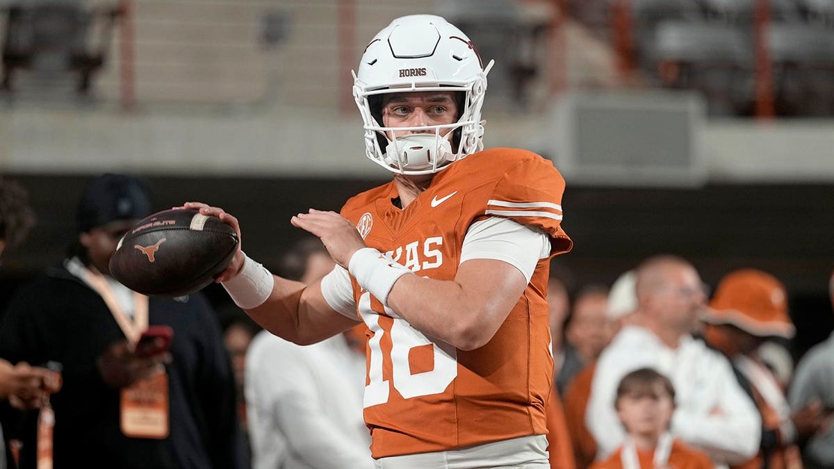 Arch Manning warms up at Darrell K Royal-Texas Memorial Stadium in Austin, Texas.